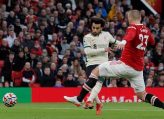 Mo Salah scores his second and Liverpool’s fourth goal in their 5-0 humiliation of Manchester United at Old Trafford.