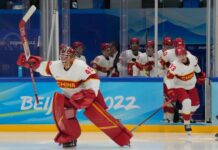 Team China goalkeeper Jeremy Smith (45) leads his team onto the ice prior to their game against Team USA on Thursday.