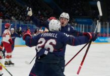 Team USA forward Noah Cates (27) celebrates with Sean Farrell (26) after scoring a goal against Team China during the second period during the Beijing 2022 Olympic Winter Games at National Indoor Stadium.